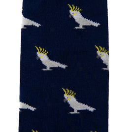 A blue and white Cockatoo Sock with white birds on it.