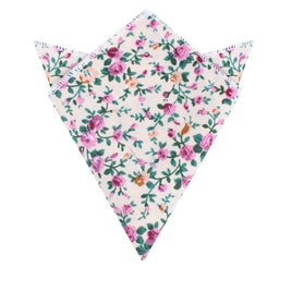 The Cream Floral Pocket Square features a white background with pink and purple flowers in a floral pattern, folded into a triangular shape with pointed edges. It's perfect for weddings and formal events.