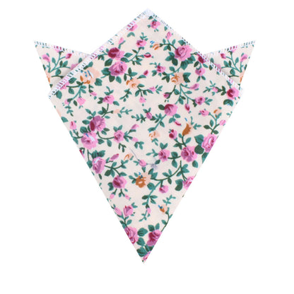 The Cream Floral Pocket Square features a white background with pink and purple flowers in a floral pattern, folded into a triangular shape with pointed edges. It's perfect for weddings and formal events.
