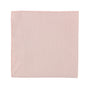A cream pink pocket square on a subtle white background.