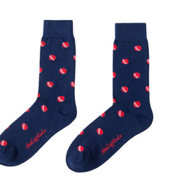 A pair of Cricket Socks with red polka dots.