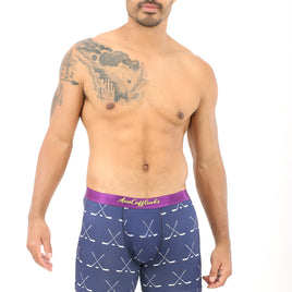A man wearing Crossed Ice Hockey Boxer stands against a plain white background, embodying the ultimate goal of coziness.