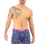 A man wearing Crossed Ice Hockey Boxer stands against a plain white background, embodying the ultimate goal of coziness.