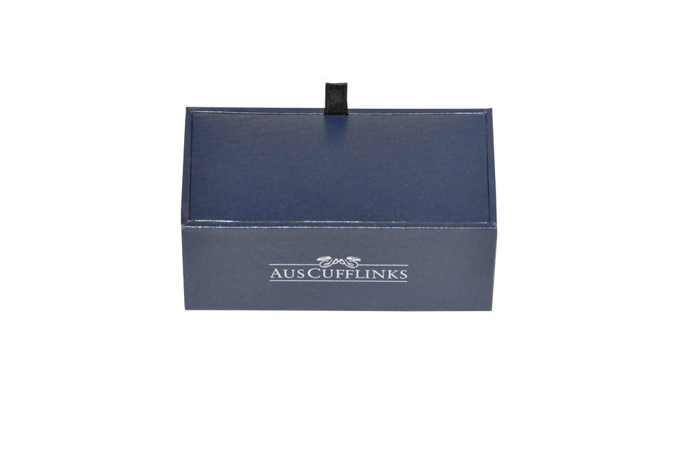 The Diamante Silver Stone Cufflinks come in a closed blue rectangular box with a small black loop on top, featuring the word "AUSCUFFLINKS" printed on the front, exuding elegance.