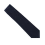 The Dark Forest Navy Skinny Cotton Tie displayed on a white background exudes grace and sophistication.