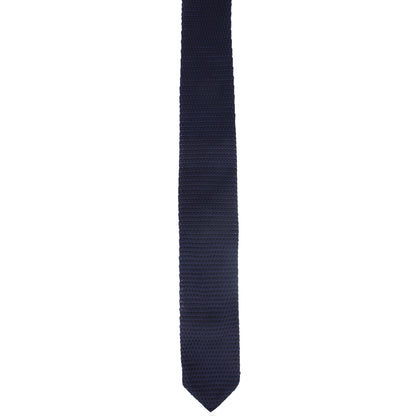 A Dark Blue Skinny Tie exudes deep-sea elegance as it is displayed vertically on a white background.