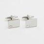 Introducing the Diamante Silver Stone Cufflinks: a pair of rectangular silver cufflinks radiating elegance with small square embellishments, set against a shimmering white background.