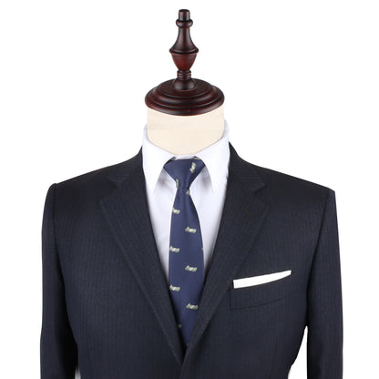 A luxe blue suit with a Dollar Bill Tie on a mannequin.