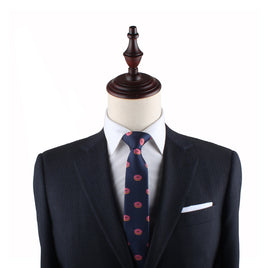 Mannequin displaying engaging style with navy suit, Donut Thin Tie, and pocket square.