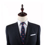 Mannequin displaying engaging style with navy suit, Donut Thin Tie, and pocket square.