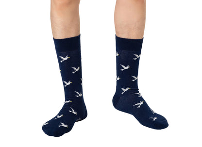 A man wearing a pair of Dove Socks.
