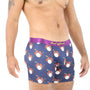 A man wearing the Drums Underwear, featuring a drum kit pattern and a purple waistband, stands against a white background, embodying the rhythm of comfort.