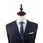 A mannequin dressed in a dark pinstripe suit, white dress shirt, and a Duck Slim Tie set against a white background.