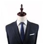 A powerful mannequin displaying grace, dressed in a suit and tie with an Eagle Slim Tie detail.
