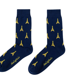 A pair of Eiffel Tower socks with yellow designs.