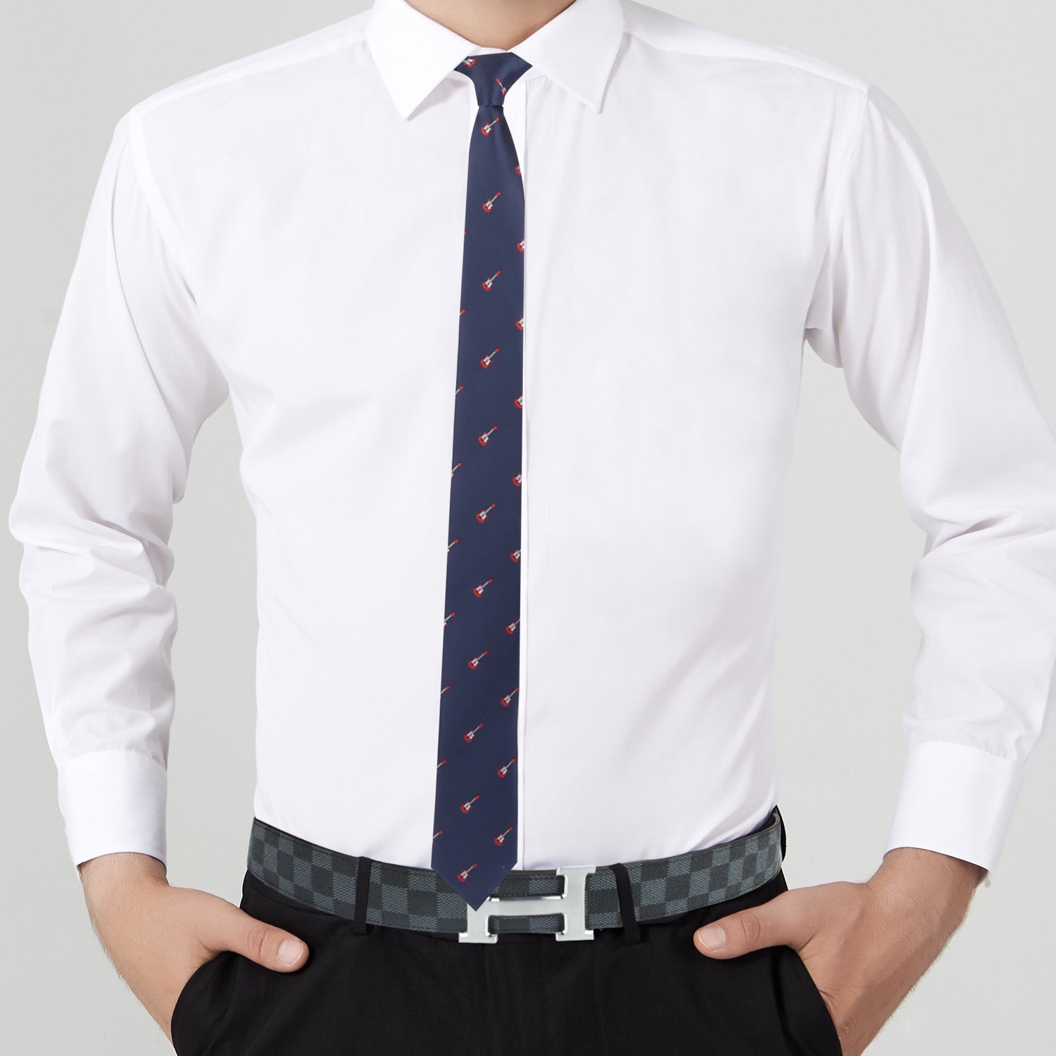 A charming man in an Electric Guitar Print Tie is posing.