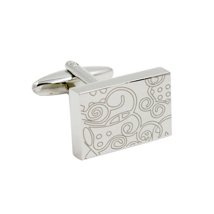 Paisley Cufflinks – Sleek & Modern Style for Men: Rectangular silver cufflink featuring an abstract engraved swirl and dot design, offering classic sophistication—an ideal gift for him. Shown on a white background.