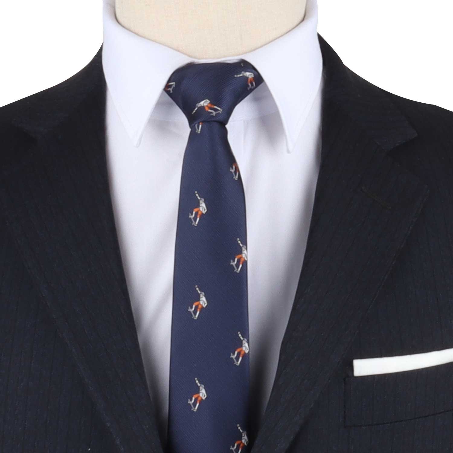 Close-up of a person wearing a dark pinstripe suit, white dress shirt, and a Extreme Sports Tie featuring a pattern of small figures. A white pocket square is visible in the jacket's breast pocket, adding an extra flair that exudes confidence.