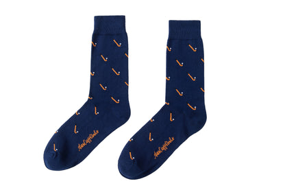 A pair of Field Hockey Socks with orange and white design.