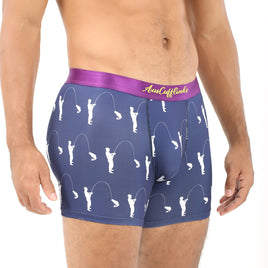 A man is sporting the Fisherman Underwear, featuring navy boxer briefs with a purple waistband and white fishing pole patterns, blending comfort and style as he dreams of the perfect catch.