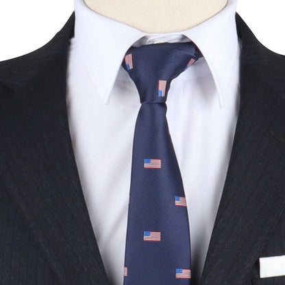 Close-up of a person in a dark suit and white shirt, effortlessly blending style with patriotism by wearing the Flag Print Tie, which is adorned with small American flag patterns.