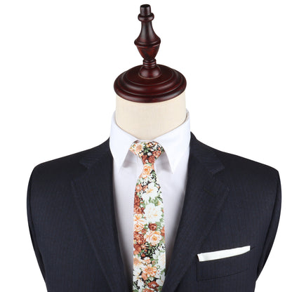 A mannequin showcasing a dark suit, white dress shirt, and a Floral Print Tie exemplifies Nature’s masterpiece through its dapper design.
