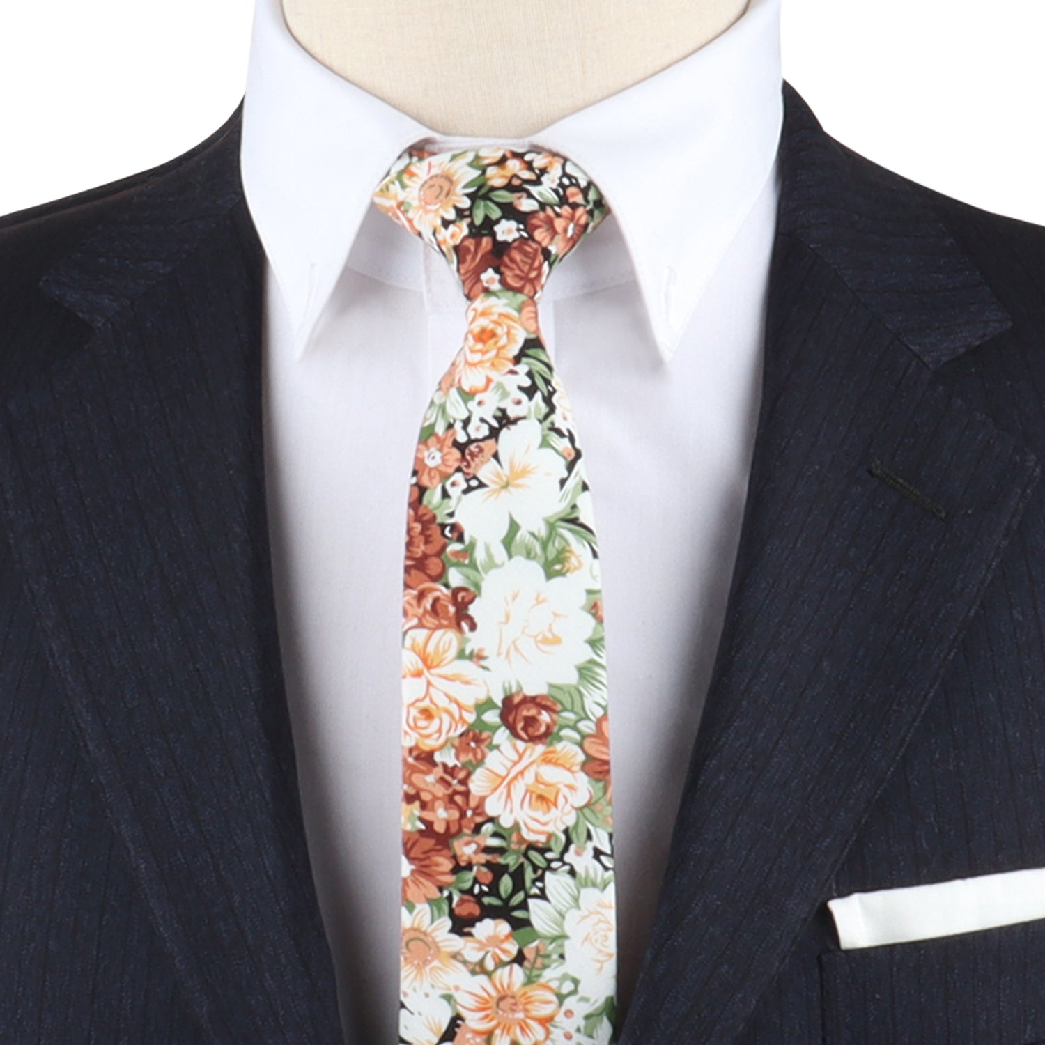 Mannequin wearing a dark pinstripe suit, white dress shirt, and a Floral Suit Necktie—truly a dapper design.