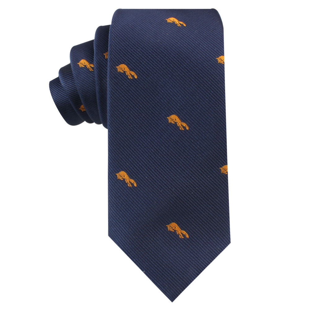 The Orange Fox Skinny Tie is a dark blue necktie with a wild allure, featuring small, repeating orange horse designs.