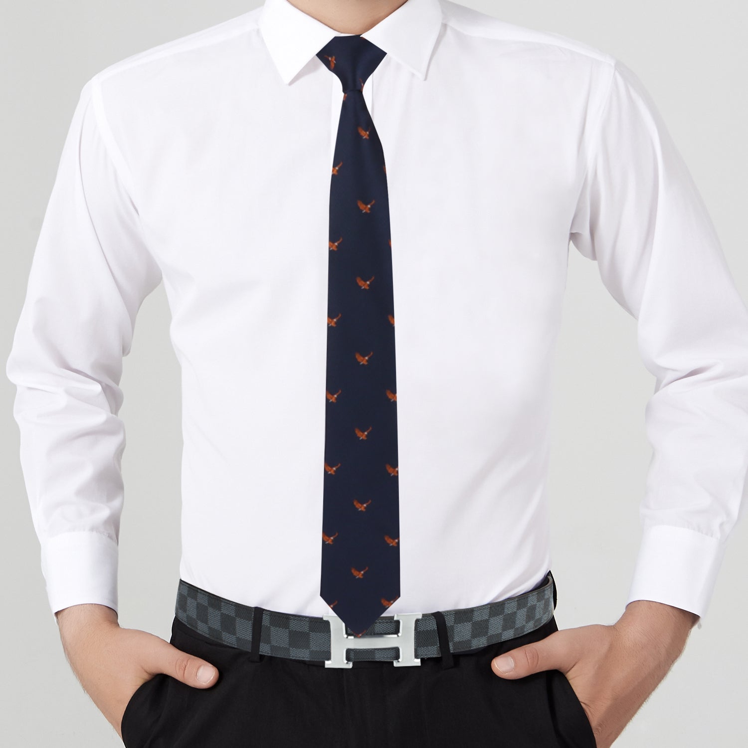 A person dressed in majestic fashion wears a crisp white dress shirt, black dress pants, the Freedom Symbol Tie with red designs, and a checkered belt with a silver buckle.