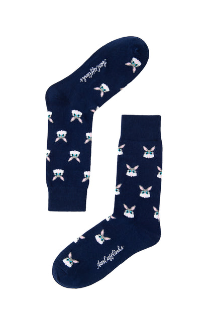 A pair of blue Bunny Socks with white cartoon faces on them.
