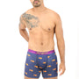 A man wearing Goldfish Boxer, featuring a blue design adorned with vibrant orange fish patterns, stands against a white background, exuding golden comfort and ready for a swim.