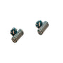 Two green and white barrel cufflinks, known for their sophisticated design, are positioned against a plain white background.