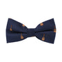 The Guitar Bow Tie is a navy blue accessory adorned with a pattern of small guitars, seamlessly blending classic style with musical charm.