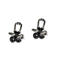 A pair of black and silver Doctor Stethoscope Cufflinks with heartfelt elegance features a unique, abstract design that resembles a stethoscope figure.