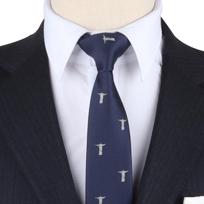 A stylish look is achieved with a white shirt and black pinstripe suit complemented by the Holy Cross Tie, which features a navy blue design adorned with a repeating pattern of statues with outstretched arms, epitomizing elegance.