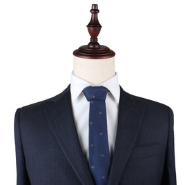 Mannequin dressed in a dark pinstriped suit jacket, white dress shirt, and an elegant Horse Print Tie featuring small patterns, set against a plain white background.