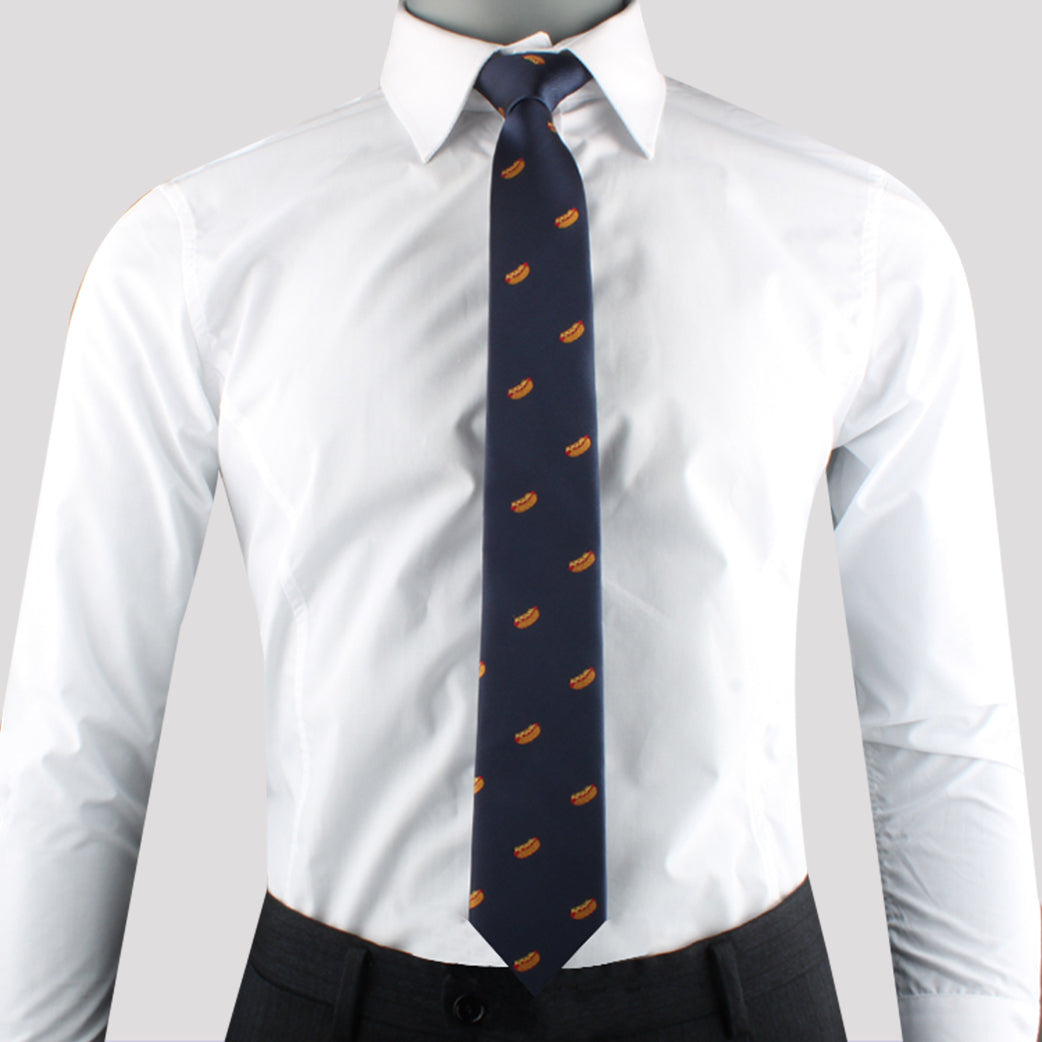 A person exuding charisma in a white dress shirt, dark trousers, and a navy blue Hotdog Fashion Accessory with a repeating orange pattern.
