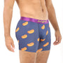 A person expressing their distinctive style and comfort in Hotdog Underwear—a pair of blue boxer briefs adorned with a whimsical hotdog pattern.