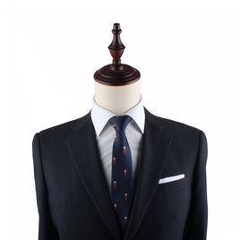 Mannequin torso showcasing a dark suit, white shirt, Ice Cream Slim Tie, and handkerchief against a white background.
