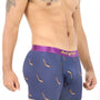 A man models the Ice Hockey Underwear, showcasing navy boxer briefs with a purple waistband and a hockey stick pattern, striking a relaxed pose against a white background.