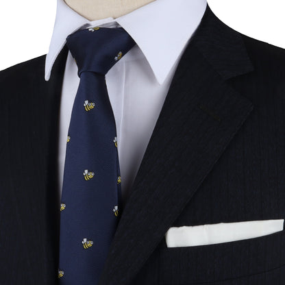 A mannequin exuding allure in a stylish suit, Insect Patern Tie, and pocket square.