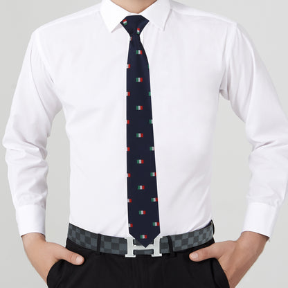 A person in a white shirt, black pants, and a Mexican Italian Flag Skinny Tie featuring small flag patterns, subtly showcasing cultural pride. Hands are resting in pockets.