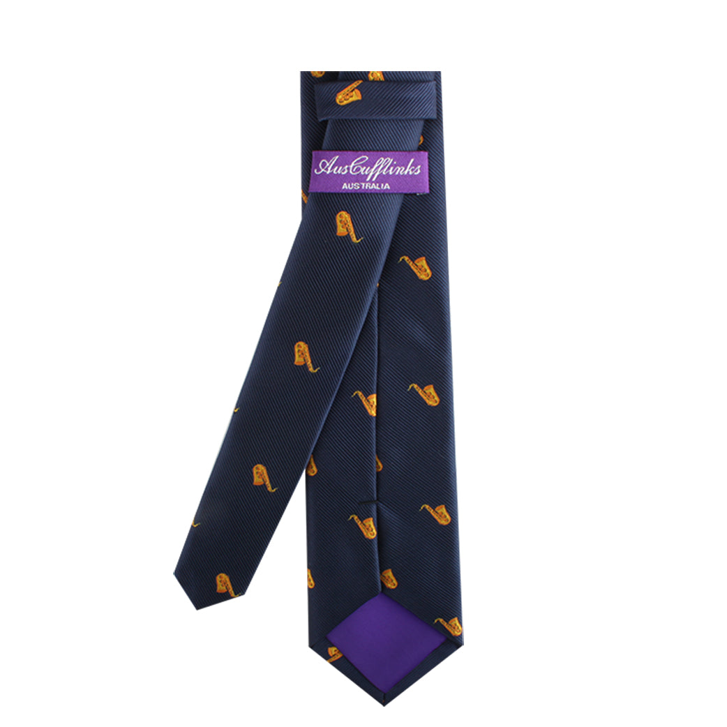 Jazz Festival Tie with yellow saxophone pattern, embodying musical elegance in its design, and featuring a branded label.