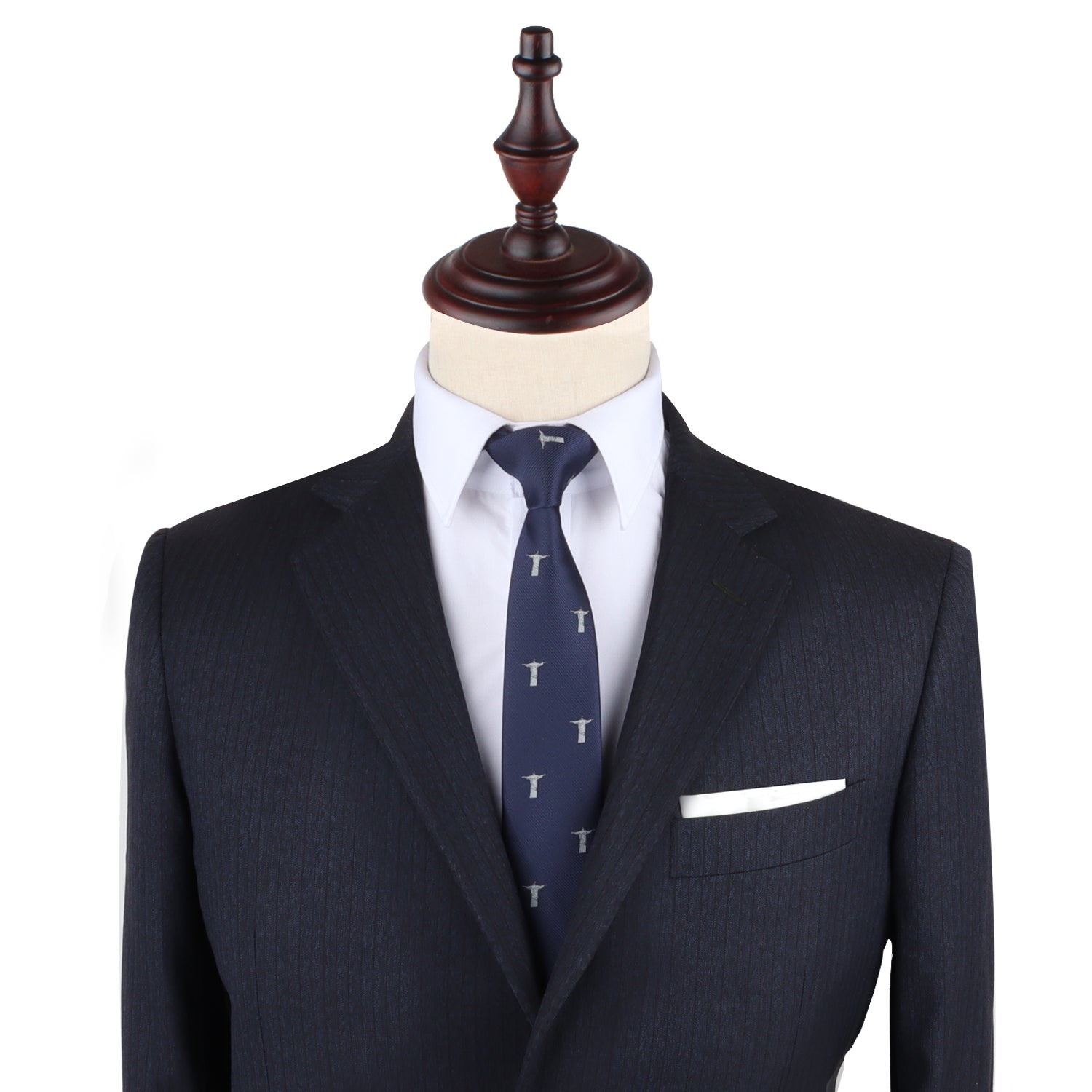 A tailored black suit on a mannequin with a white dress shirt and the Jesus Slim Tie, an ensemble that perfectly captures the stylish form and timeless elegance.