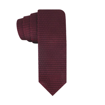 A rolled-up Knitted Necktie, featuring a rich texture and exuding cozy elegance with its warm hues, displayed against a white background.