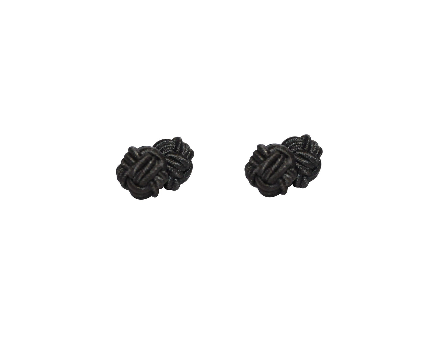 The Black Sphere Cufflinks exude dark elegance on a white background, their perfectly rounded form showcasing a timeless appeal.