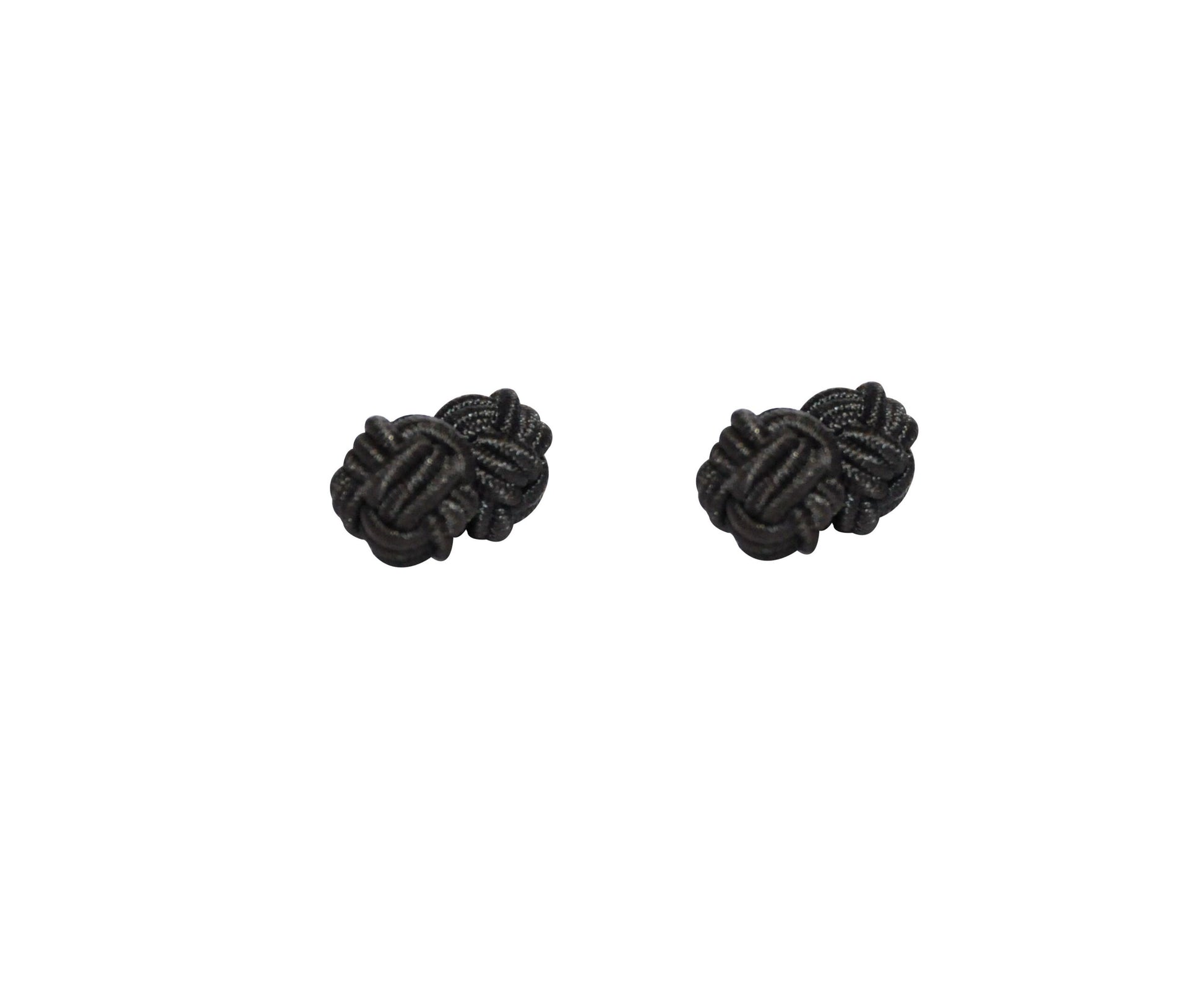The Black Sphere Cufflinks exude dark elegance on a white background, their perfectly rounded form showcasing a timeless appeal.