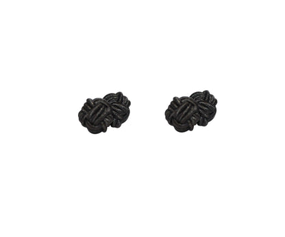 The Black Sphere Cufflinks exude dark elegance on a white background, their perfectly rounded form showcasing a timeless appeal.