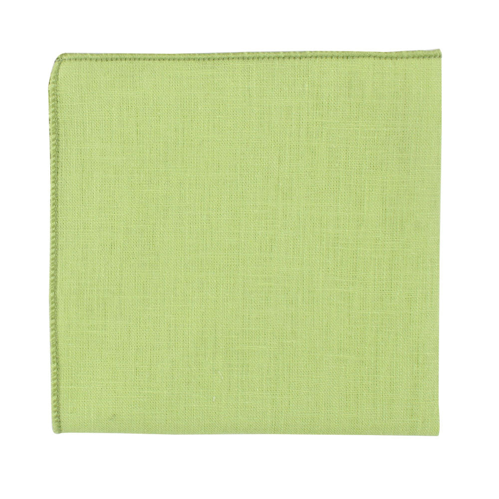 Displayed on a plain white background, a folded piece from the Lime Green Cotton Skinny Tie & Pocket Square Set showcases its zesty hue and visible woven texture, presenting a sharp silhouette.