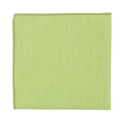 Displayed on a plain white background, a folded piece from the Lime Green Cotton Skinny Tie & Pocket Square Set showcases its zesty hue and visible woven texture, presenting a sharp silhouette.